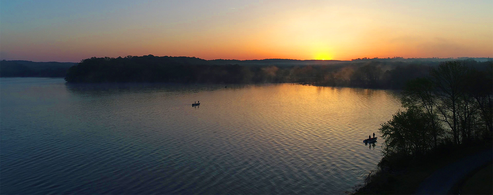 Kentucky Lake Marina at Sunrise with Fishermen near Cane Creek Marina and Campground